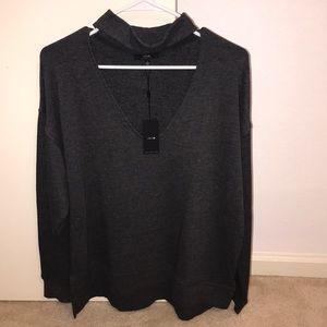 Gray sweater with low cut neck